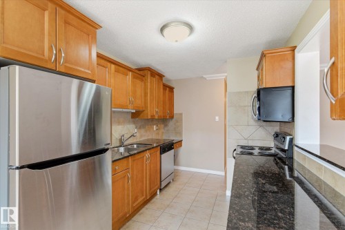 204 10720 84 Avenue, Edmonton, AB - Indoor Photo Showing Kitchen With Stainless Steel Kitchen