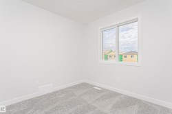 Light-filled interior space with a window featuring white trim - 