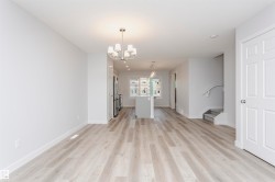 Spacious interior with wood-finish flooring extending throughout - 