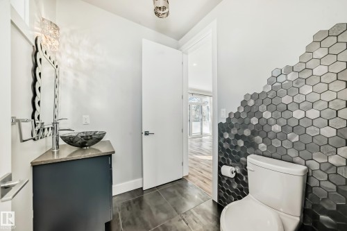 Main floor 2pc bath - 10506 68 Avenue, Edmonton, AB - Indoor Photo Showing Bathroom