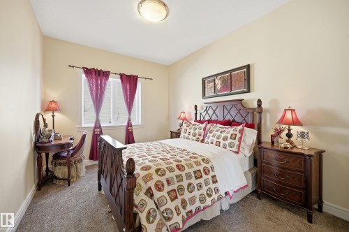Bedroom featuring warm neutral wall tones and a vaulted ceiling - 3105 65 Street, Beaumont, AB - Indoor Photo Showing Bedroom