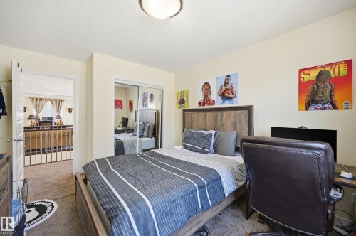 Carpeted room with light-toned walls and a flush-mount ceiling light - 3105 65 Street, Beaumont, AB - Indoor Photo Showing Bedroom