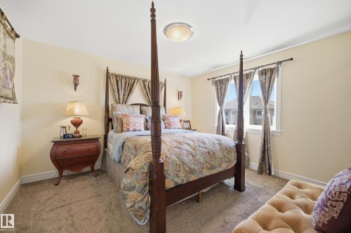 Carpeted room with light-toned walls and crown molding - 3105 65 Street, Beaumont, AB - Indoor Photo Showing Bedroom