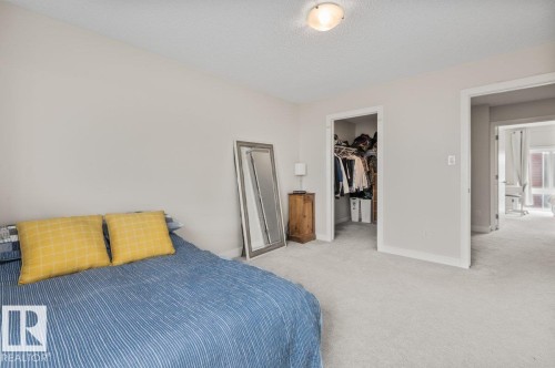 Light-colored wall paint throughout - 21 979 Crystallina Nera Way, Edmonton, AB - Indoor Photo Showing Bedroom