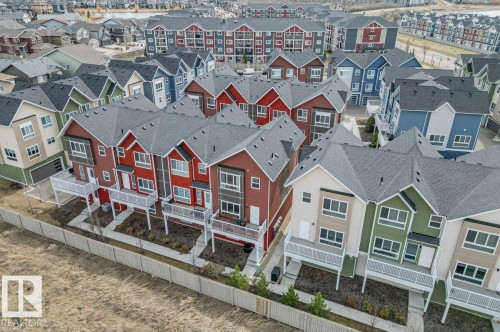 Modern multi-level townhomes with diverse exterior color palettes - 21 979 Crystallina Nera Way, Edmonton, AB - Outdoor With Facade