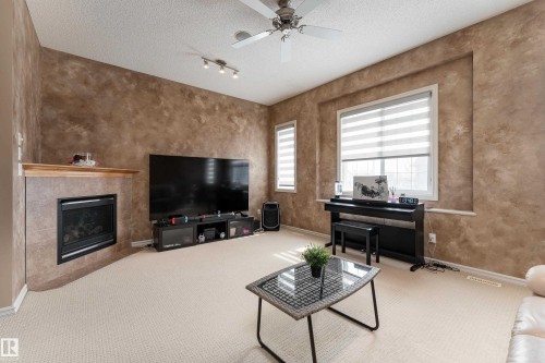 8706 175 Avenue, Edmonton, AB - Indoor Photo Showing Living Room With Fireplace