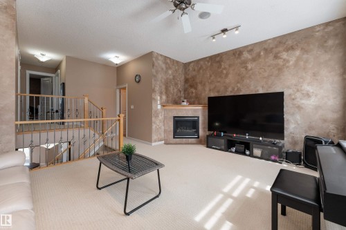 8706 175 Avenue, Edmonton, AB - Indoor Photo Showing Other Room With Fireplace