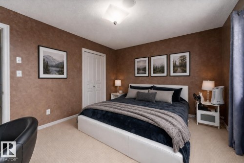 Bed is virtually staged. - 8706 175 Avenue, Edmonton, AB - Indoor Photo Showing Bedroom