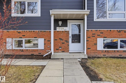 Property exterior featuring a combination of brick and horizontal siding - 1729 65 Street, Edmonton, AB - Outdoor