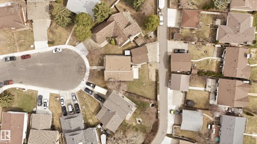 Aerial perspective showcasing a residential neighborhood with varied property sizes and established landscaping - 1729 65 Street, Edmonton, AB - 