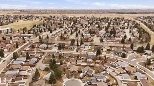 Aerial perspective showcasing a residential area with varied housing styles - 1729 65 Street, Edmonton, AB - Outdoor With View