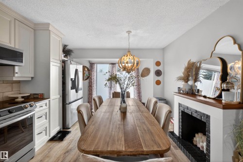 18939 78 Avenue, Edmonton, AB - Indoor Photo Showing Dining Room With Fireplace