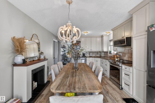 18939 78 Avenue, Edmonton, AB - Indoor Photo Showing Dining Room With Fireplace