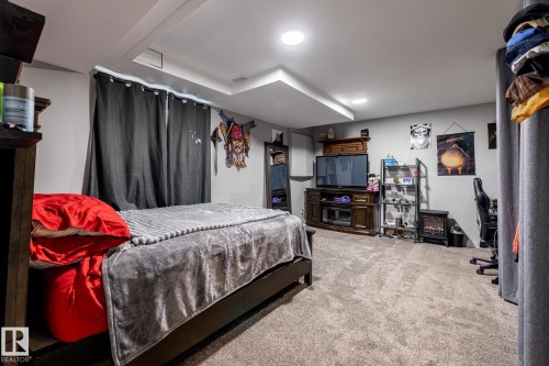 Carpeted room featuring recessed lighting and a tray ceiling detail - 7 Doolan Place, St. Albert, AB - Indoor Photo Showing Other Room