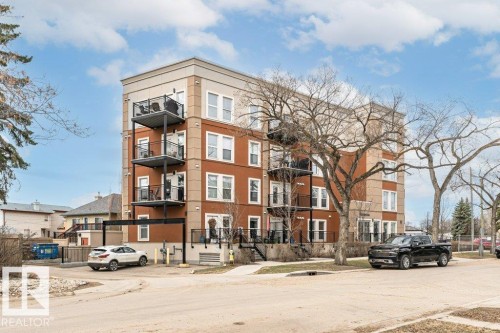 Multi-story building featuring a brick and stucco exterior - 204 10126 144 Street, Edmonton, AB - Outdoor With Balcony With Facade
