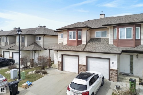 Contemporary townhome featuring a neutral siding facade with dark brown trim accents, a bay window, and an attached two-car garage - 17 171 Brintnell Boulevard, Edmonton, AB - Outdoor With Facade
