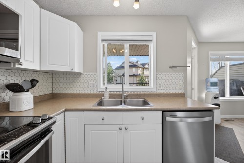 26 4731 Terwillegar Common, Edmonton, AB - Indoor Photo Showing Kitchen With Double Sink