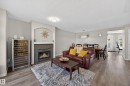26 4731 Terwillegar Common, Edmonton, AB  - Indoor Photo Showing Living Room With Fireplace 