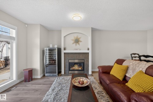 26 4731 Terwillegar Common, Edmonton, AB - Indoor Photo Showing Living Room With Fireplace