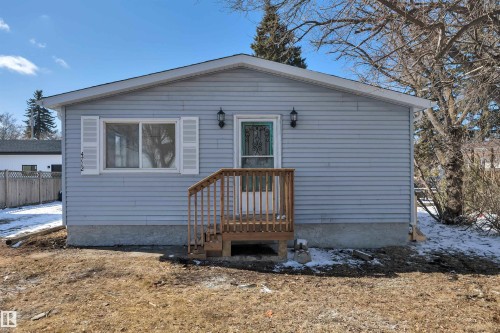 Light blue siding exterior featuring white trim and a gabled roofline - 4712 49 Street, Calmar, AB - Outdoor