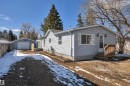 Light blue siding exterior with white window shutters - 4712 49 Street, Calmar, AB  - Outdoor 