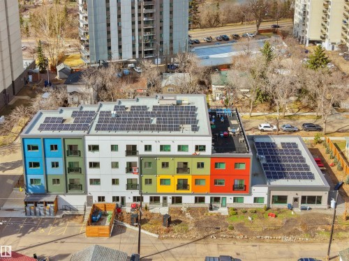 Modern multi-level building with solar panel arrays - 403 10115 88 Avenue, Edmonton, AB - Outdoor With Facade