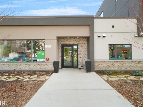 Modern exterior facade featuring light-colored brick accents - 403 10115 88 Avenue, Edmonton, AB - Outdoor With Exterior