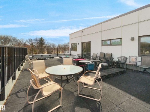Expansive rooftop deck featuring dark, textured flooring - 403 10115 88 Avenue, Edmonton, AB - Outdoor