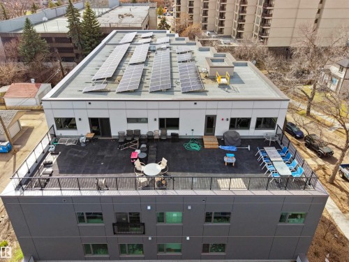 Rooftop deck featuring a black railing system and dark surface material - 403 10115 88 Avenue, Edmonton, AB - Outdoor