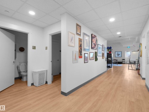 Hallway with wood-finish flooring and recessed lighting - 403 10115 88 Avenue, Edmonton, AB - Indoor Photo Showing Other Room