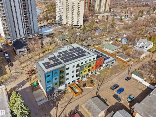 Modern multi-story building featuring a flat roof with solar panels - 403 10115 88 Avenue, Edmonton, AB - Outdoor
