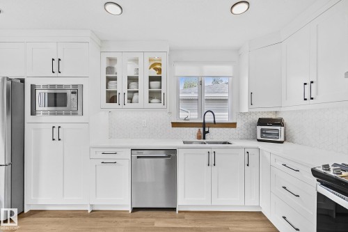 15011 77 Avenue, Edmonton, AB - Indoor Photo Showing Kitchen With Double Sink With Upgraded Kitchen
