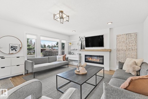 15011 77 Avenue, Edmonton, AB - Indoor Photo Showing Living Room With Fireplace