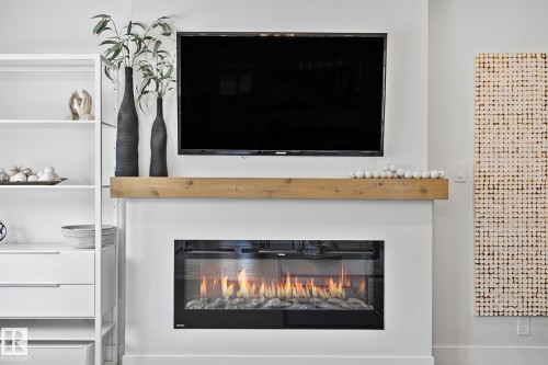 15011 77 Avenue, Edmonton, AB - Indoor Photo Showing Living Room With Fireplace