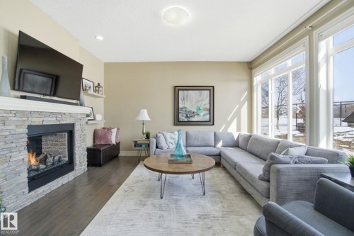 2133 Blue Jay Point(E), Edmonton, AB - Indoor Photo Showing Living Room With Fireplace