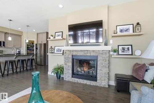 2133 Blue Jay Point(E), Edmonton, AB - Indoor Photo Showing Living Room With Fireplace