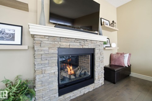 2133 Blue Jay Point(E), Edmonton, AB - Indoor Photo Showing Other Room With Fireplace