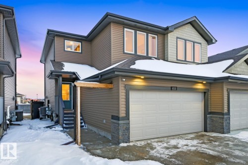 The property features a two-story exterior with brown siding and stone accents - 405 Genesis Court, Stony Plain, AB - Outdoor With Exterior