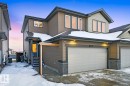 The property features a two-story exterior with brown siding and stone accents - 405 Genesis Court, Stony Plain, AB  - Outdoor With Exterior 