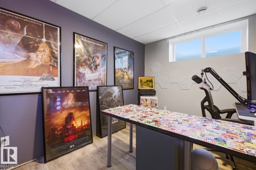 This room features a window providing natural light, light-colored flooring, and a drop ceiling - 405 Genesis Court, Stony Plain, AB - Indoor Photo Showing Other Room