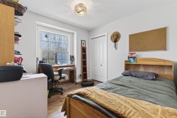 Bright room featuring wood-finish flooring and white walls - 