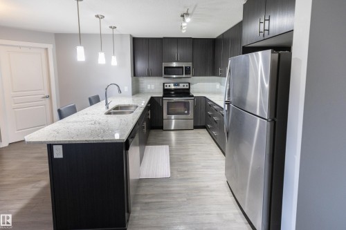 107 3670 139 Avenue, Edmonton, AB - Indoor Photo Showing Kitchen With Stainless Steel Kitchen With Double Sink With Upgraded Kitchen