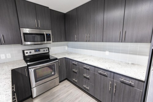 107 3670 139 Avenue, Edmonton, AB - Indoor Photo Showing Kitchen With Stainless Steel Kitchen With Upgraded Kitchen
