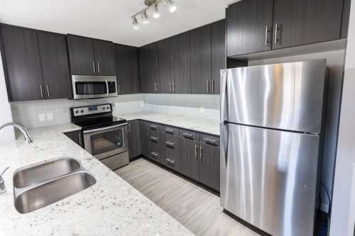 107 3670 139 Avenue, Edmonton, AB - Indoor Photo Showing Kitchen With Stainless Steel Kitchen With Double Sink With Upgraded Kitchen
