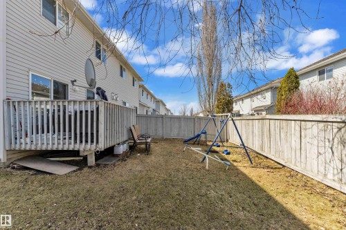 Wood-decked patio with protective railing - 64 4350 23 Street, Edmonton, AB - Outdoor
