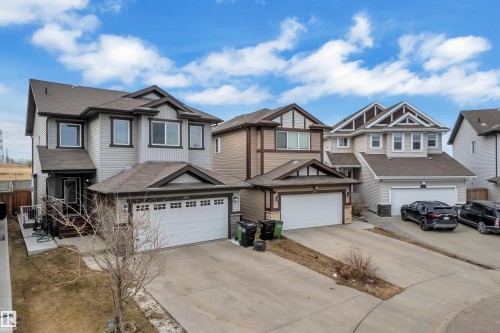 Contemporary two-story residence featuring light gray siding and dark trim accents - 3363 13 Avenue, Edmonton, AB - Outdoor With Facade