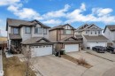 Contemporary two-story residence featuring light gray siding and dark trim accents - 3363 13 Avenue, Edmonton, AB  - Outdoor With Facade 