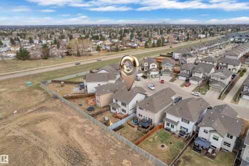 Aerial view showcasing a residential neighborhood with detached homes, each featuring individual fenced backyards - 3363 13 Avenue, Edmonton, AB - Outdoor With View