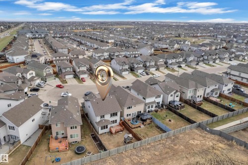 Residential neighborhood featuring multiple single-family homes with gray shingle roofs - 3363 13 Avenue, Edmonton, AB - Outdoor With View