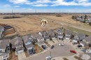 Aerial view of a residential cul-de-sac featuring multiple detached homes with attached garages, shingled roofs, and varied exterior finishes - 3363 13 Avenue, Edmonton, AB  - Outdoor With View 